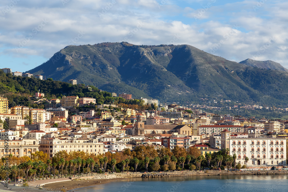 Touristic City by the Sea. Salerno, Italy. Aerial View. Cityscape and mountains background