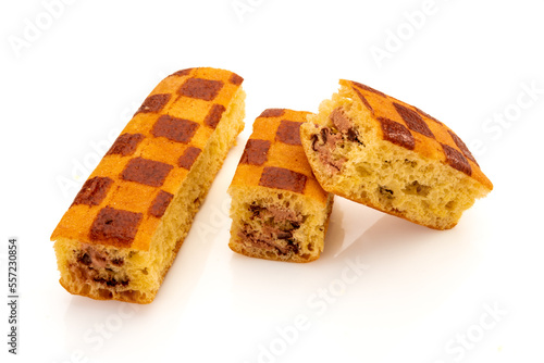Sponge cake snack filled with chocolate, one whole and one cut with a view of the filling, isolated on white