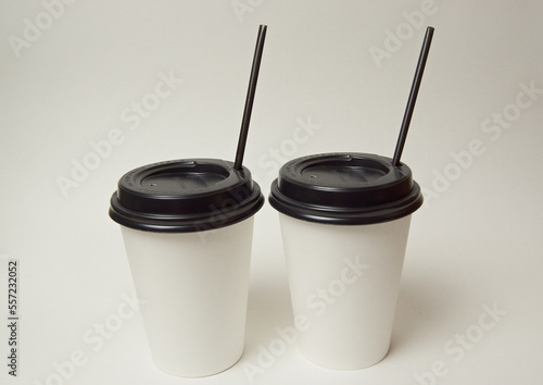 two glasses of takeaway coffee on a white background
