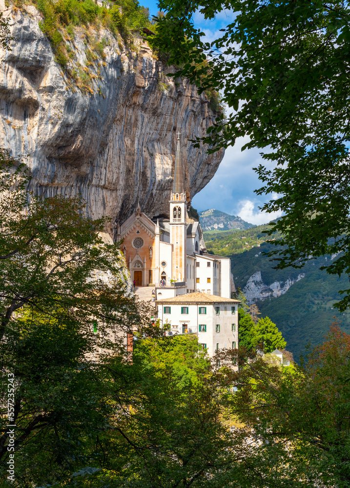 View from the mountain hiking trail of the Santuario de la Madonna della Corona, a picturesque historic mountainside church built in 1625 in Spiazzi, Italy.	