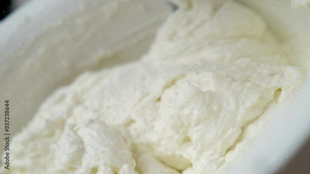the process of cooking tiramisu. chef cooks homemade mascarpone. whipped cream is mixed with cottage cheese the process of cooking tiramisu. chef cooks homemade mascarpone. whipped cream is mixed with cottage cheese