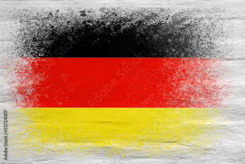 Flag of Germany. Flag painted on a white plastered brick wall. Brick background. Copy space. Textured background