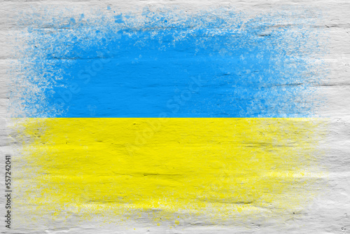 Flag of Ukraine. Flag painted on a white plastered brick wall. Brick background. Copy space. Textured background