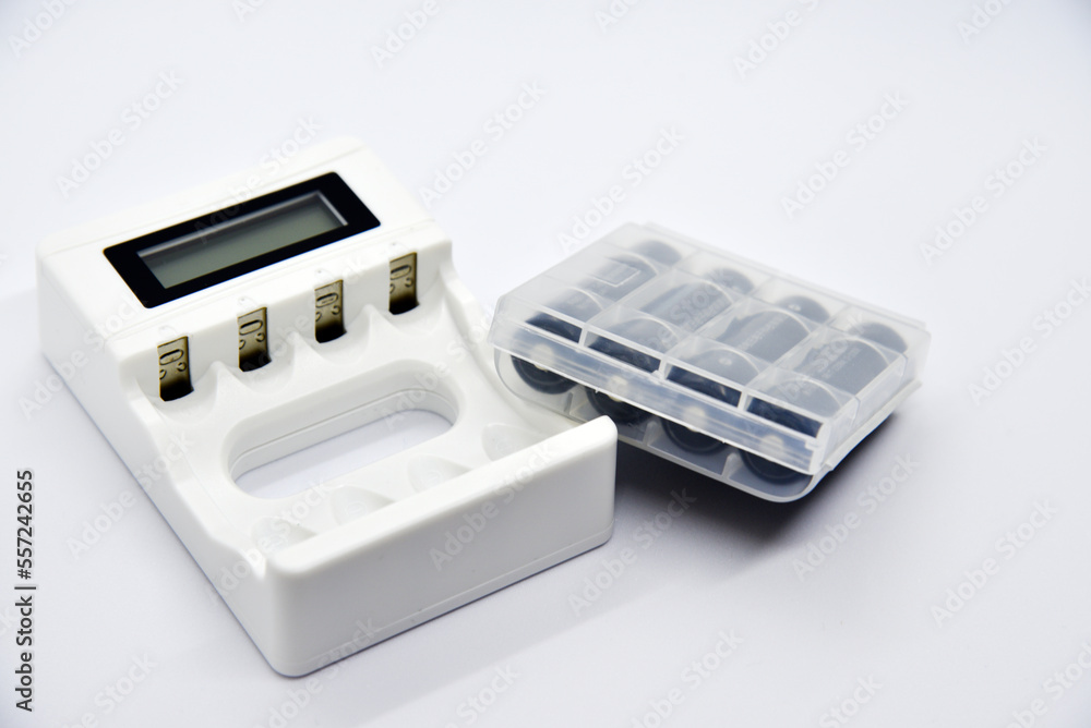White battery charger. A white device for a battery charger. White battery charger. A white device for a battery charger.