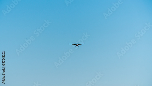 Airplane in flight against the blue sky