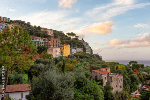 Rocky Coast and Homes in Touristic Town, Sorrento, Italy. Amalfi Coast. Colorful Sunset Sky
