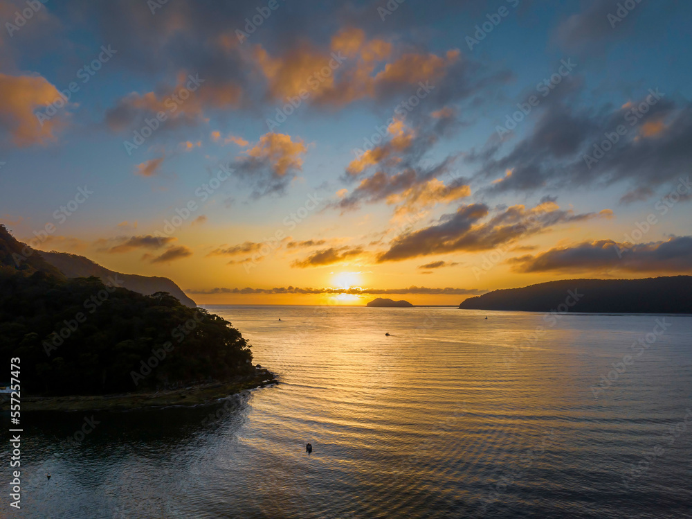 Sunrise views over the bay with boats and mountain ranges from Patonga