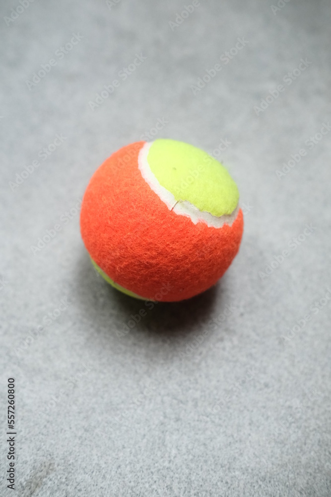 Two tennis balls against grain background. Sport equipment
