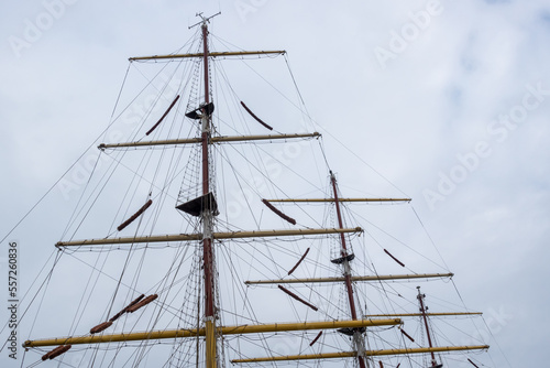 Rigging masts on a deep-sea sailing ship. The mast photographed against a cloudy sky