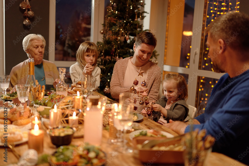 Cheerful family spending time together on Christmas horizontal portrait Cheerful family spending time together on Christmas horizontal portrait