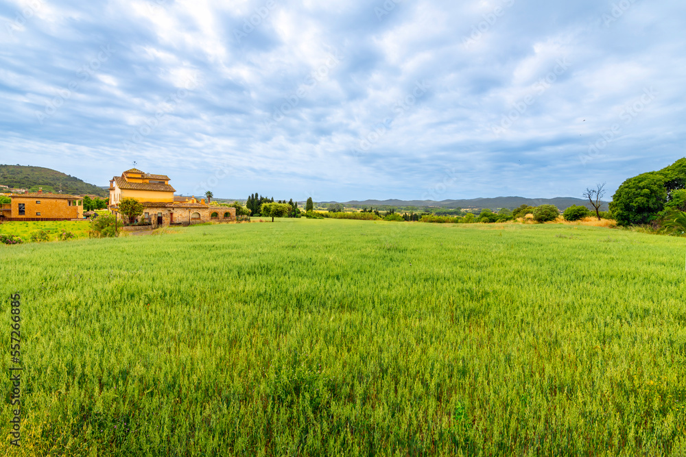View of a Spanish villa and the Catalonian hills and countryside from the medieval village of Pals, Spain, in the Girona province of Northern Spain along the Costa Brava Coast.