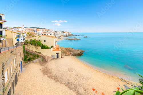 The rocky coast, sandy beach and whitewashed village at the fishing town of Calella de Palafrugell, on the Costa Brava Spanish coast. 