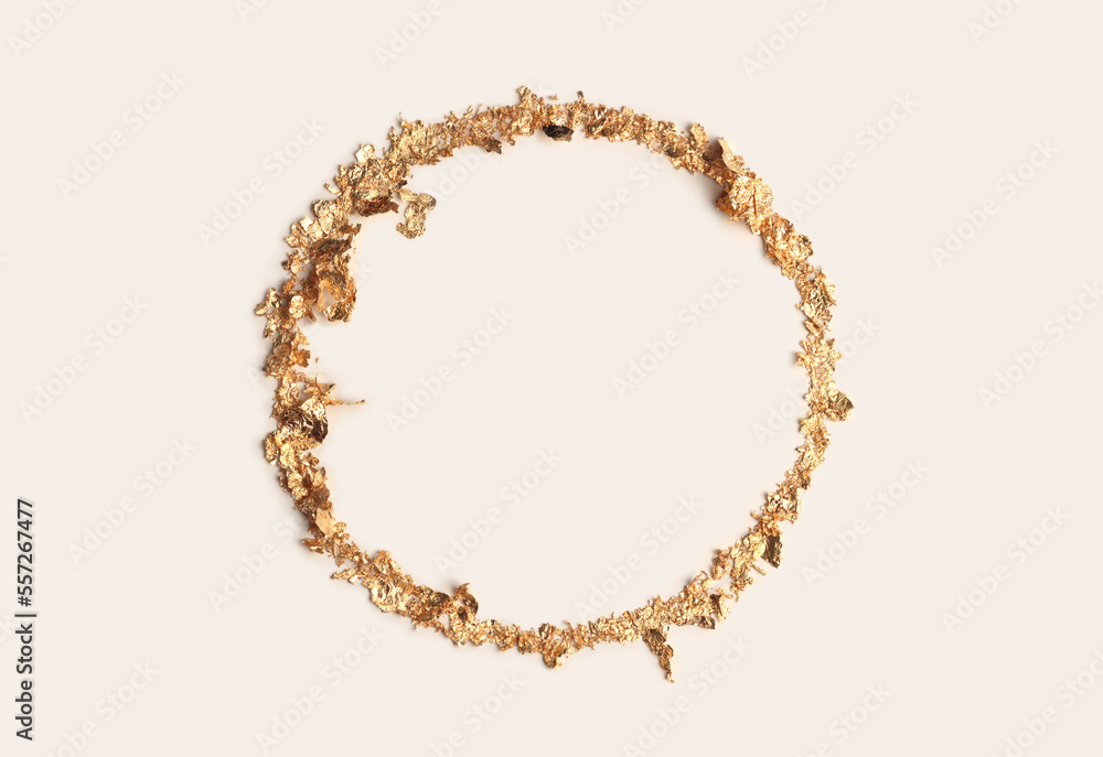 Obraz premium Gold (bronze) glitter empty ring circle frame on beige gray paper background. Abstract copy space texture.
