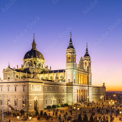 Fototapeta Naklejka Na Ścianę i Meble -  Madrid, Spain 28-12-2022 The Almudena Cathedral during a colorful sunset, it is the most important  and Catholic religious building in Madrid and a visit is free of charge except for the crypt  