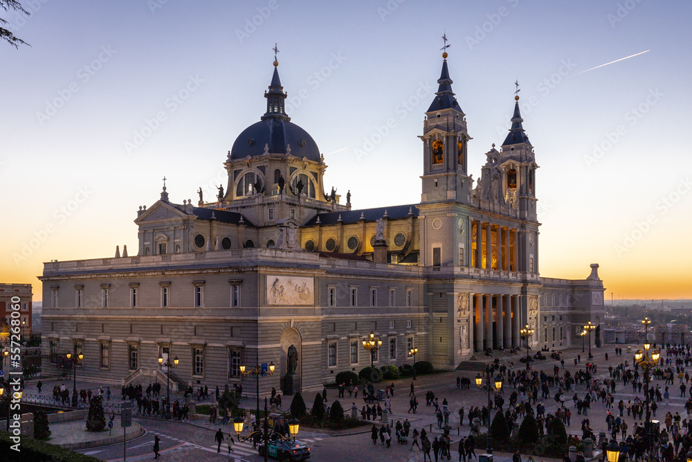 Naklejka premium Madrid, Spain 28-12-2022 The Almudena Cathedral during a colorful sunset, it is the most important and Catholic religious building in Madrid and a visit is free of charge except for the crypt 