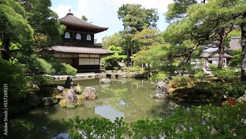 Scenic landscape of pond in springtime and architecture of Kannon-Hall in Ginkakuji Temple. Ginkaku-ji or Silver Pavilion, officially Jisho-ji, is a Zen temple in Higashiyama District, Kyoto, Japan. photo