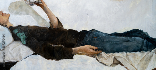 Bild auf Leinwand A young man with curly hair holds a handkerchief in his hand