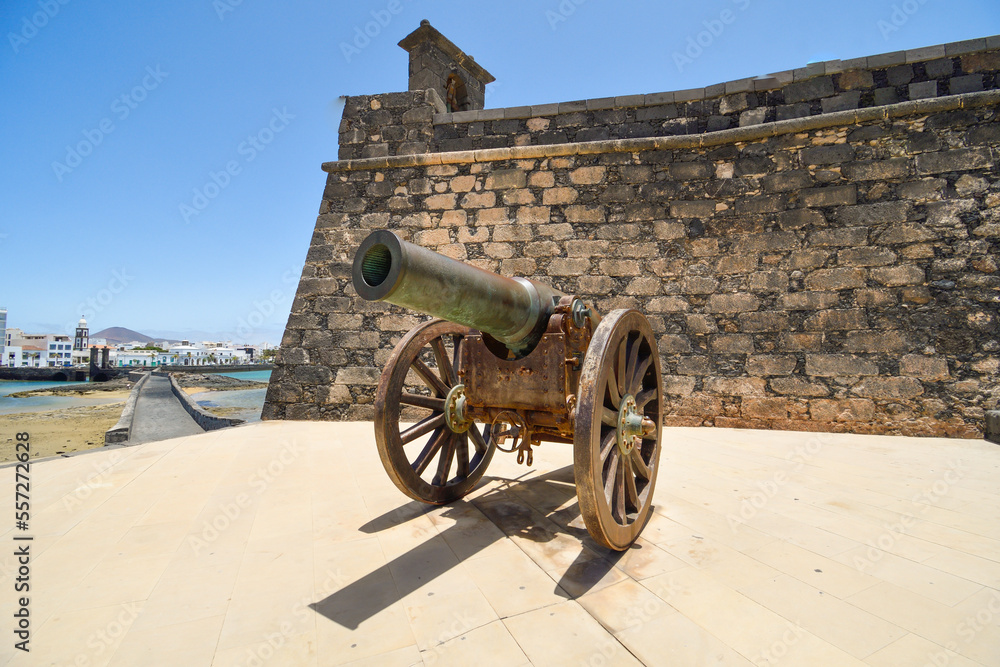 Old cannon of the Castillo de San Gabriel in Arrecife pointing towards the bay