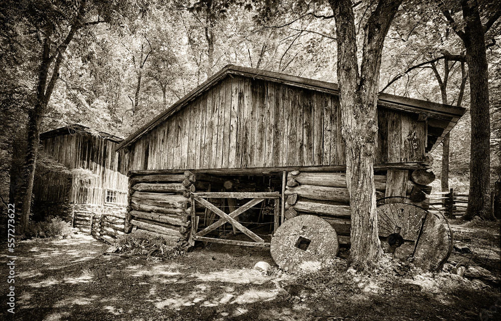 Old Grist Wheels In Front of Barn Near The Smokies Old Grist Wheels In Front of Barn Near The Smokies