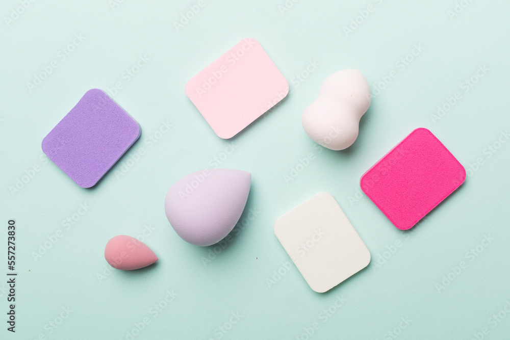 Beauty blenders on color background, top view Beauty blenders on color background, top view