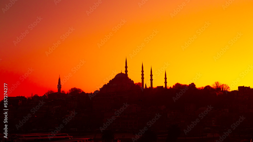 The historical Süleymaniye Mosque, built in the name of Suleiman the Magnificent in Istanbul, silhouette, sunset, space and writing area