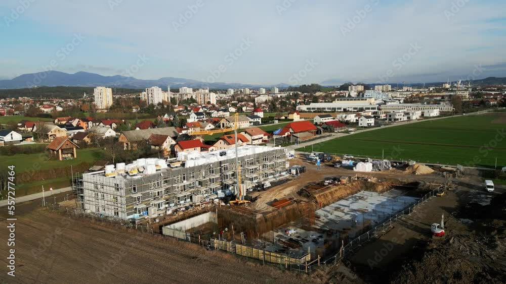 Drone flying over construction site of a new residential building in the country side Drone flying over construction site of a new residential building in the country side
