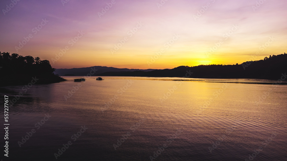 Aerial view of landscape sunset with Reservoir and raft house Thailand