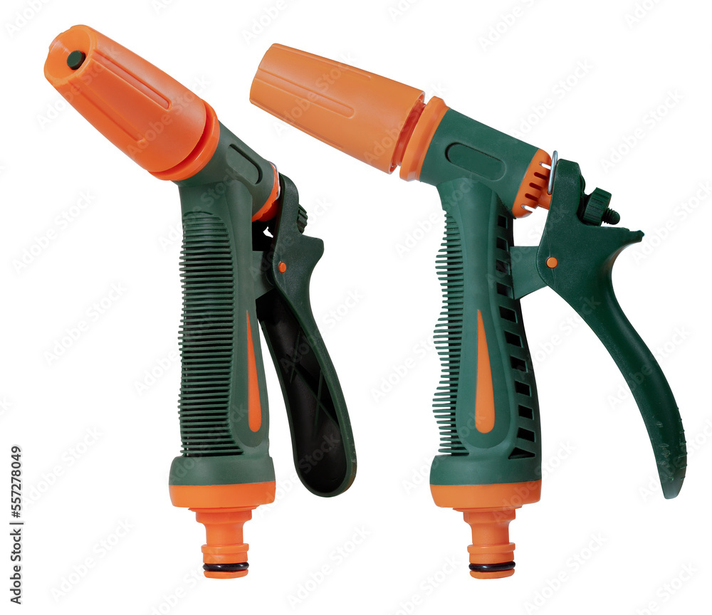 Watering gun in the garden on an isolated background. Watering gun in the garden on an isolated background.