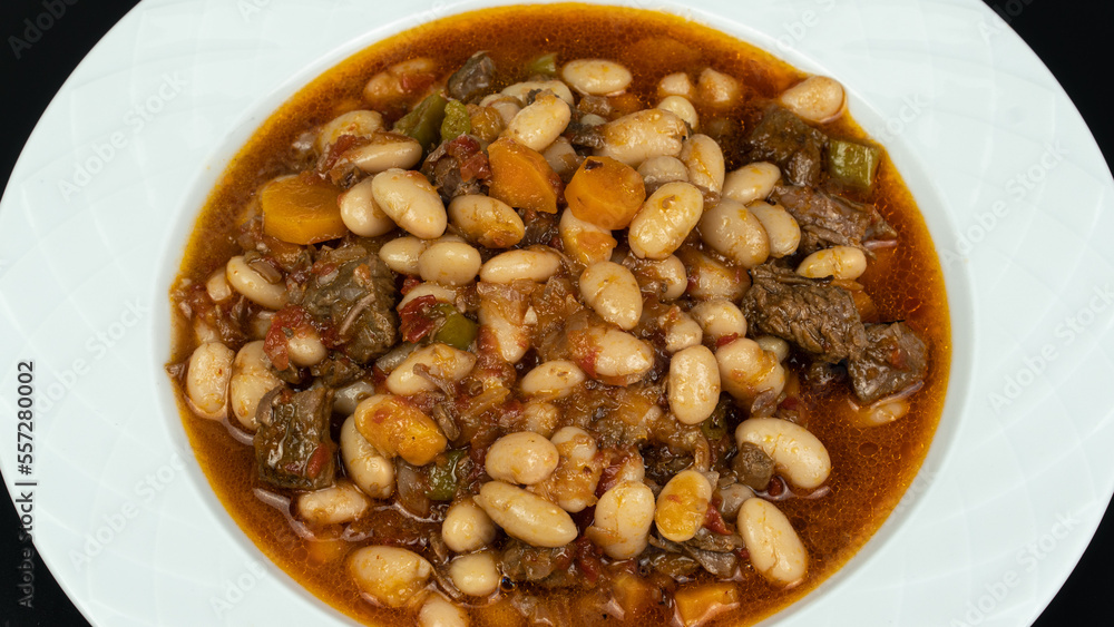 Kuru Fasulye. Traditional Turkish cuisine. Turkish dish. Haricot beans with meat. Top view Kuru Fasulye. Traditional Turkish cuisine. Turkish dish. Haricot beans with meat. Top view