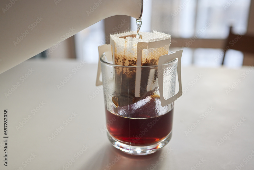 brewing process,a bag filled with boiling water for drip coffee in a