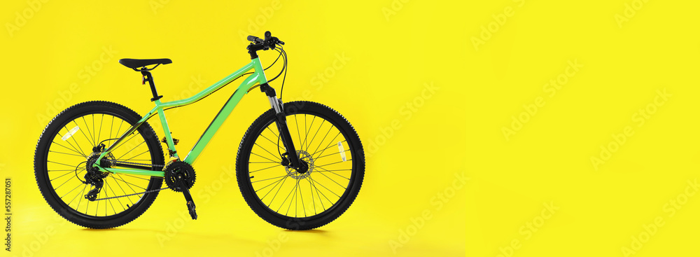Modern bicycle on yellow background, space for text. Banner design Modern bicycle on yellow background, space for text. Banner design
