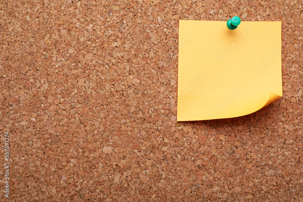 Blank paper note pinned to cork background. Space for text Blank paper note pinned to cork background. Space for text