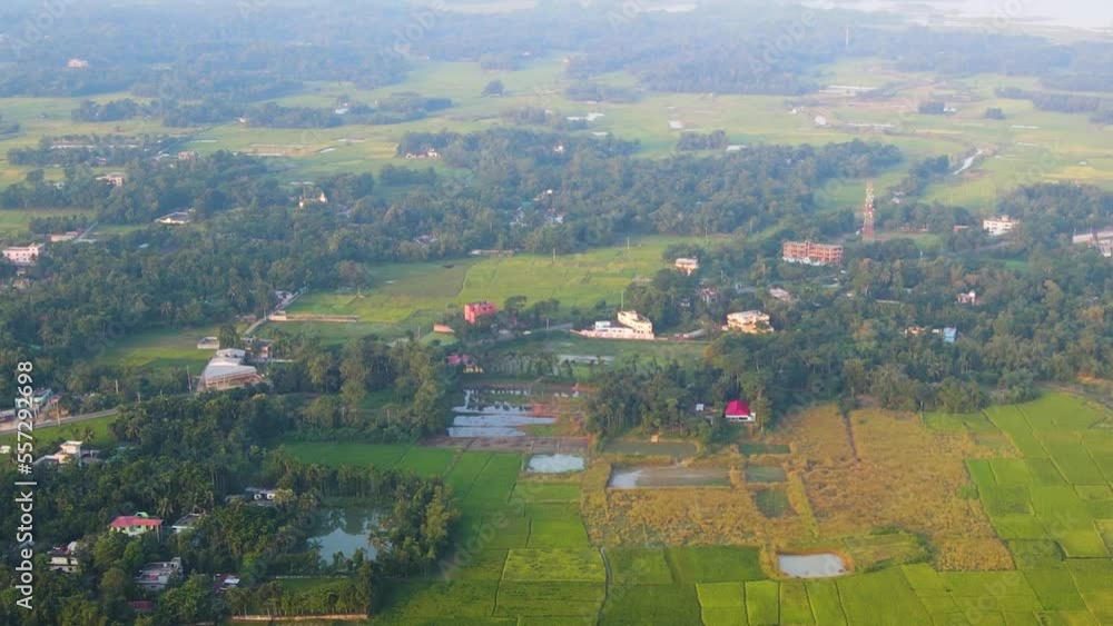 Aerial View Of Green Farmland Plots Of Land With Pockets Of Tropical Forests In Sylhet. Dolly Push Aerial View Of Green Farmland Plots Of Land With Pockets Of Tropical Forests In Sylhet. Dolly Push