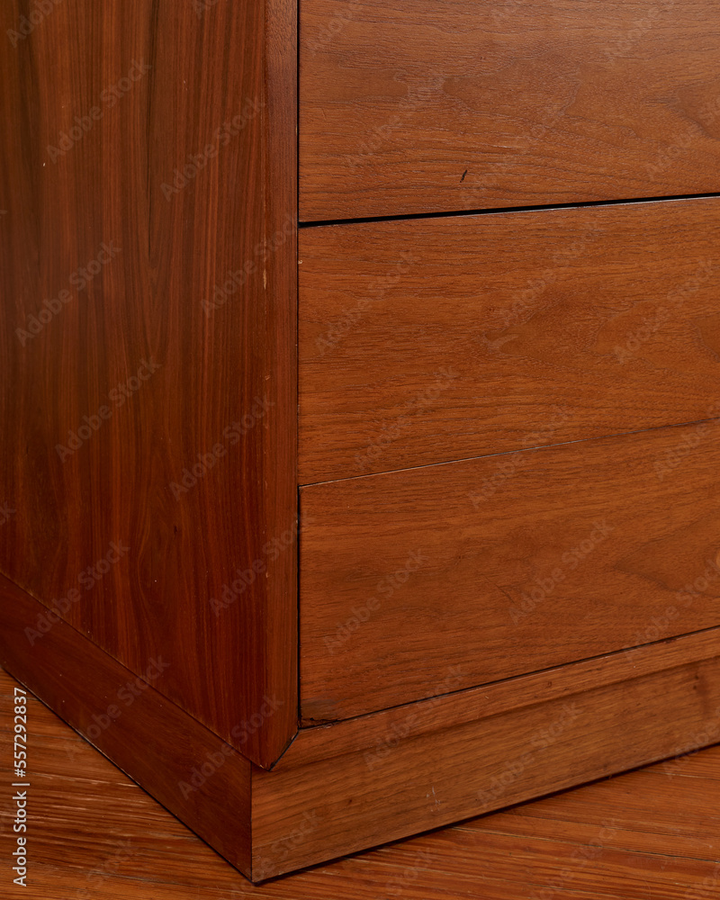 Walnut cabinet drawer. Close-up detail with wood grain. Walnut cabinet drawer. Close-up detail with wood grain.
