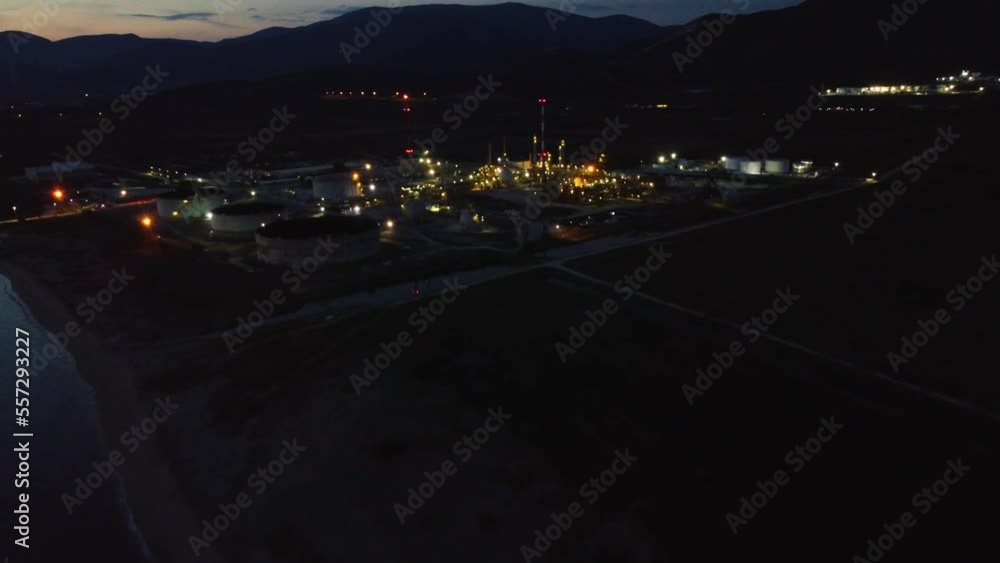 Aerial approaching oil refinery at night, environment, industry concept. Aerial approaching oil refinery at night, environment, industry concept.