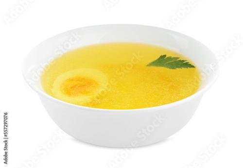 Delicious bouillon with egg and parsley in bowl on white background