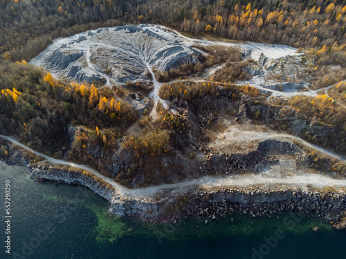 The autumn forest, lake, canyon, and quarry from above. The Ruskeala Park view from the drone