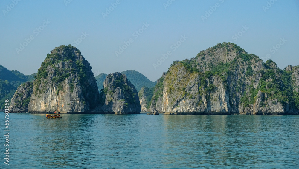 Cat Ba, Vietnam - December 21, 2022: A fishing boat in Lan Ha Bay in Cat Ba, Vietnam.