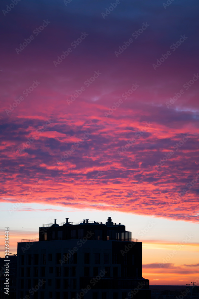 Pink clouds at sunset. Urban landscape. Beautiful sky of Astana. High quality photo