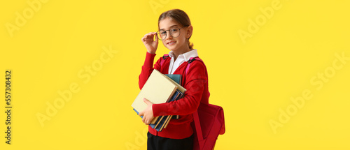 Cute little school girl wit...