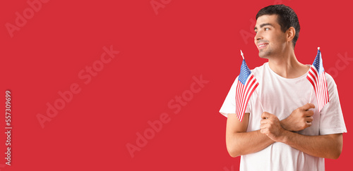 Young man holding USA flags...