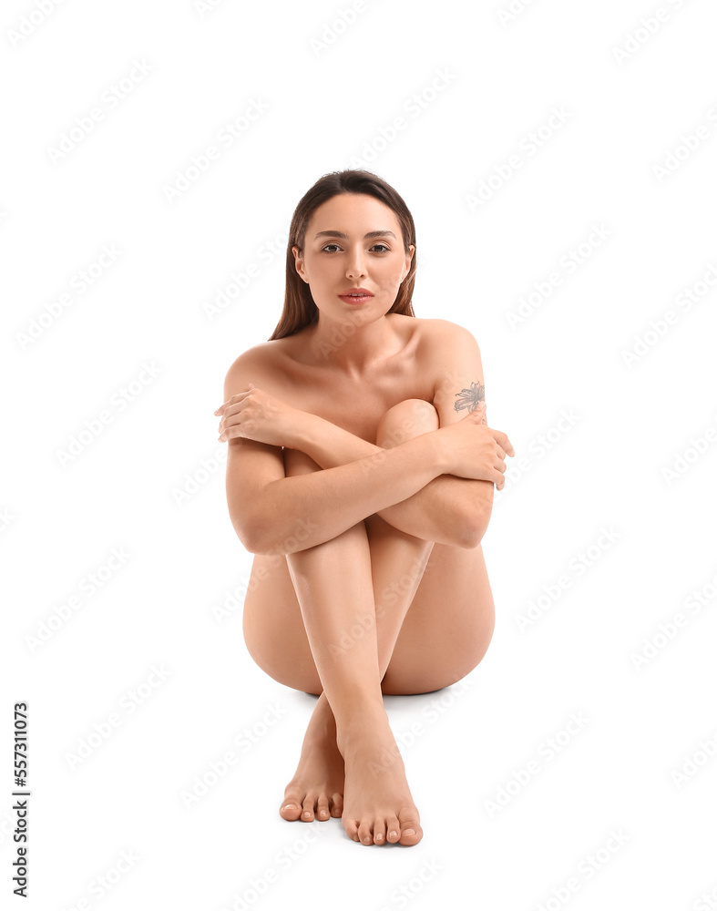 Fototapeta premium Naked beautiful young woman sitting on white background