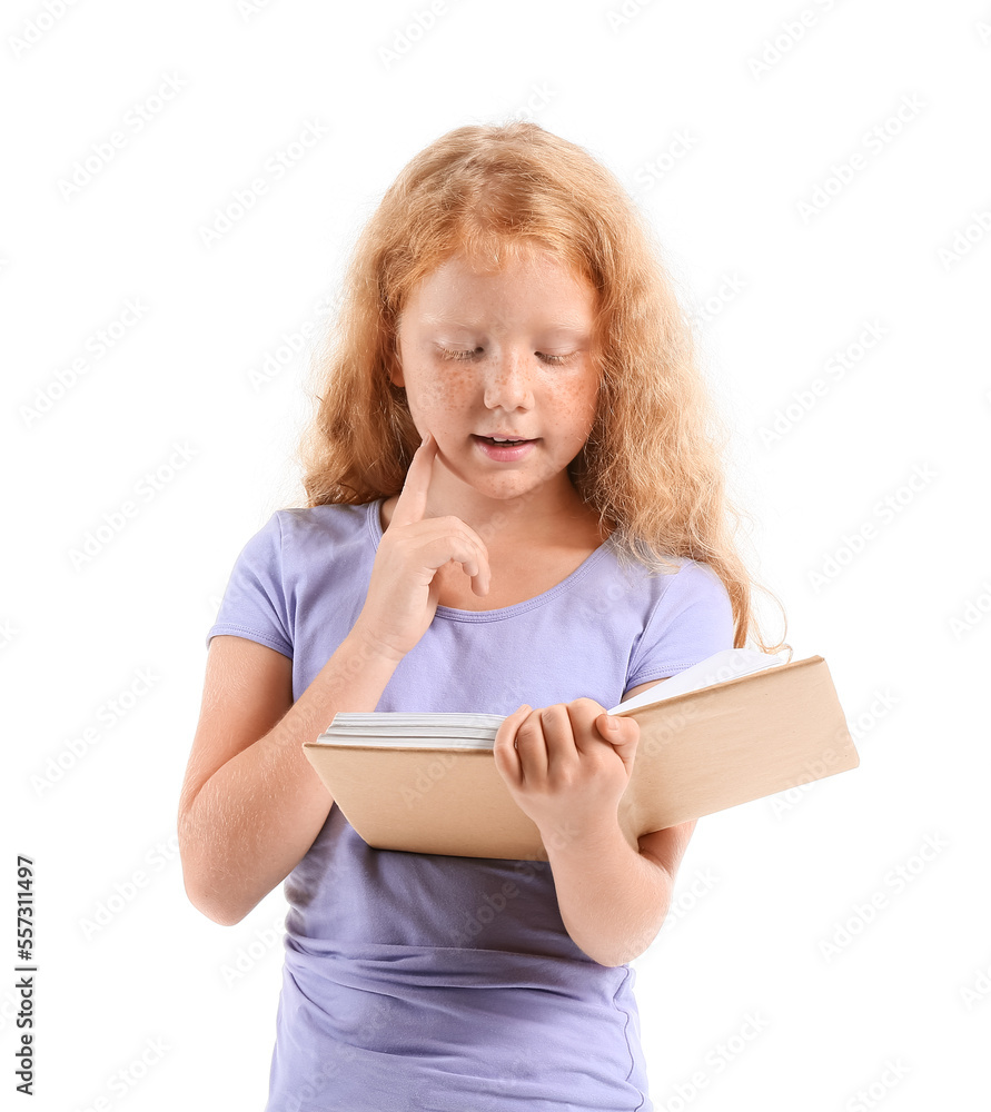 Little redhead girl reading old book on white background Little redhead girl reading old book on white background