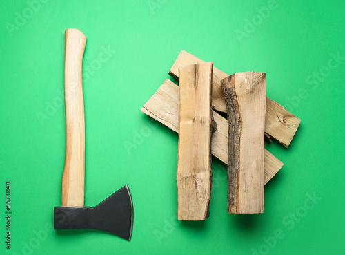 Ax with firewood on green b...