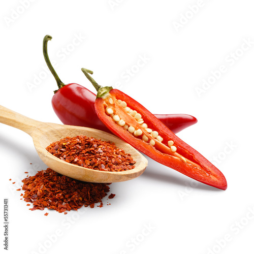 Spoon of chipotle chili flakes on white background