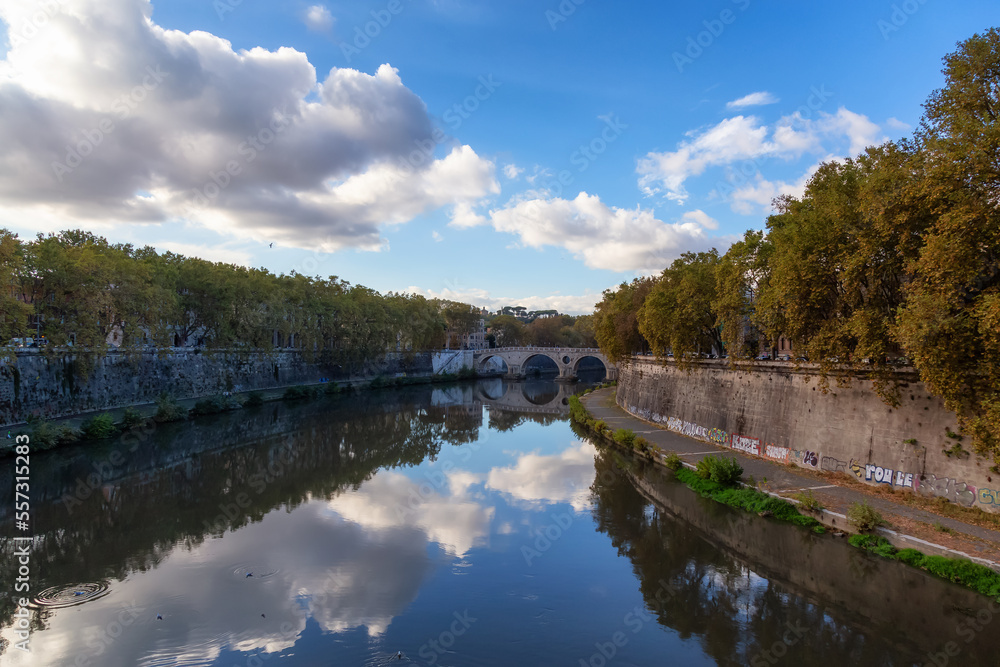 River Tiber and Bridge in a historic City, Rome, Italy. Sunny and Cloudy day.