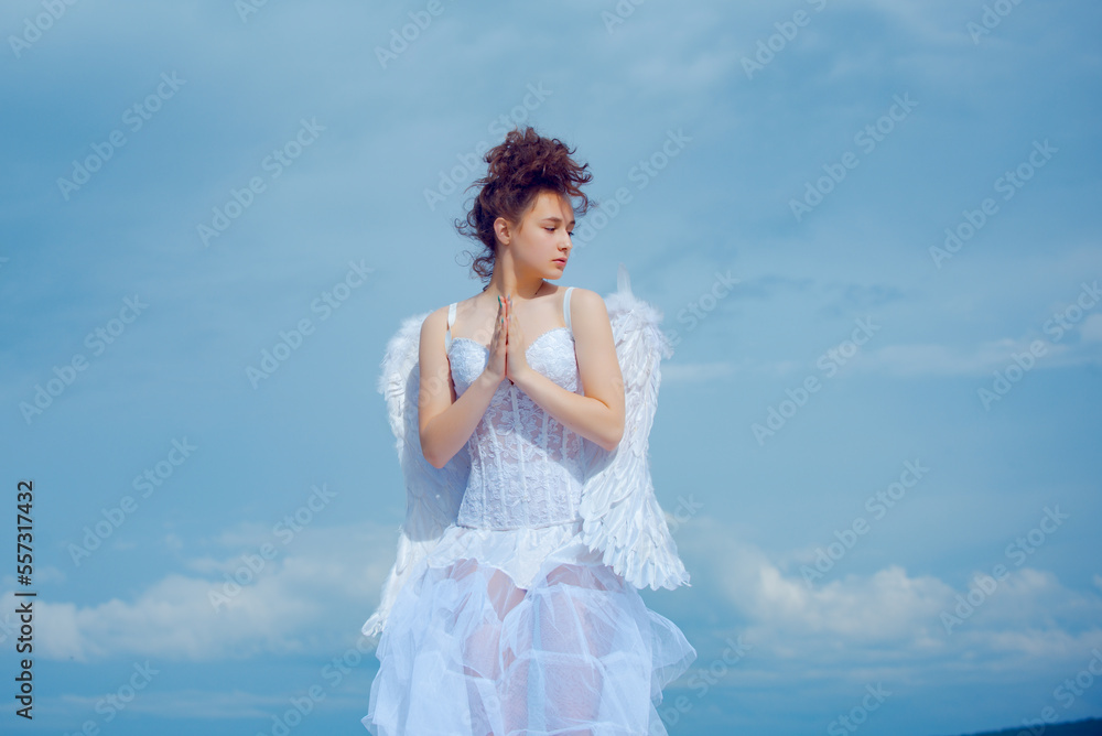 Valentines angel teen praying. Angel teen in heaven.