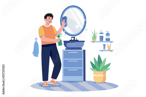 Man Cleaning Mirror In The Bathroom