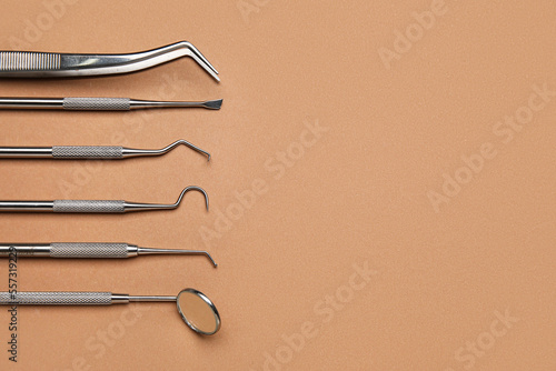 Dental tools on brown backg...