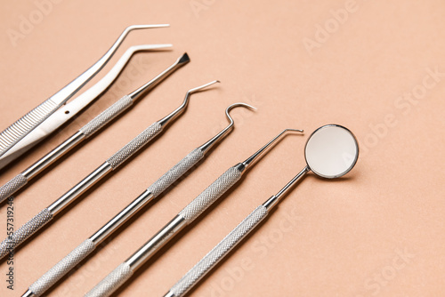 Dental tools on brown background, closeup